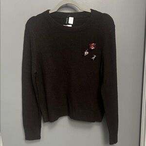 Elegant Black Sweater with Floral Accents